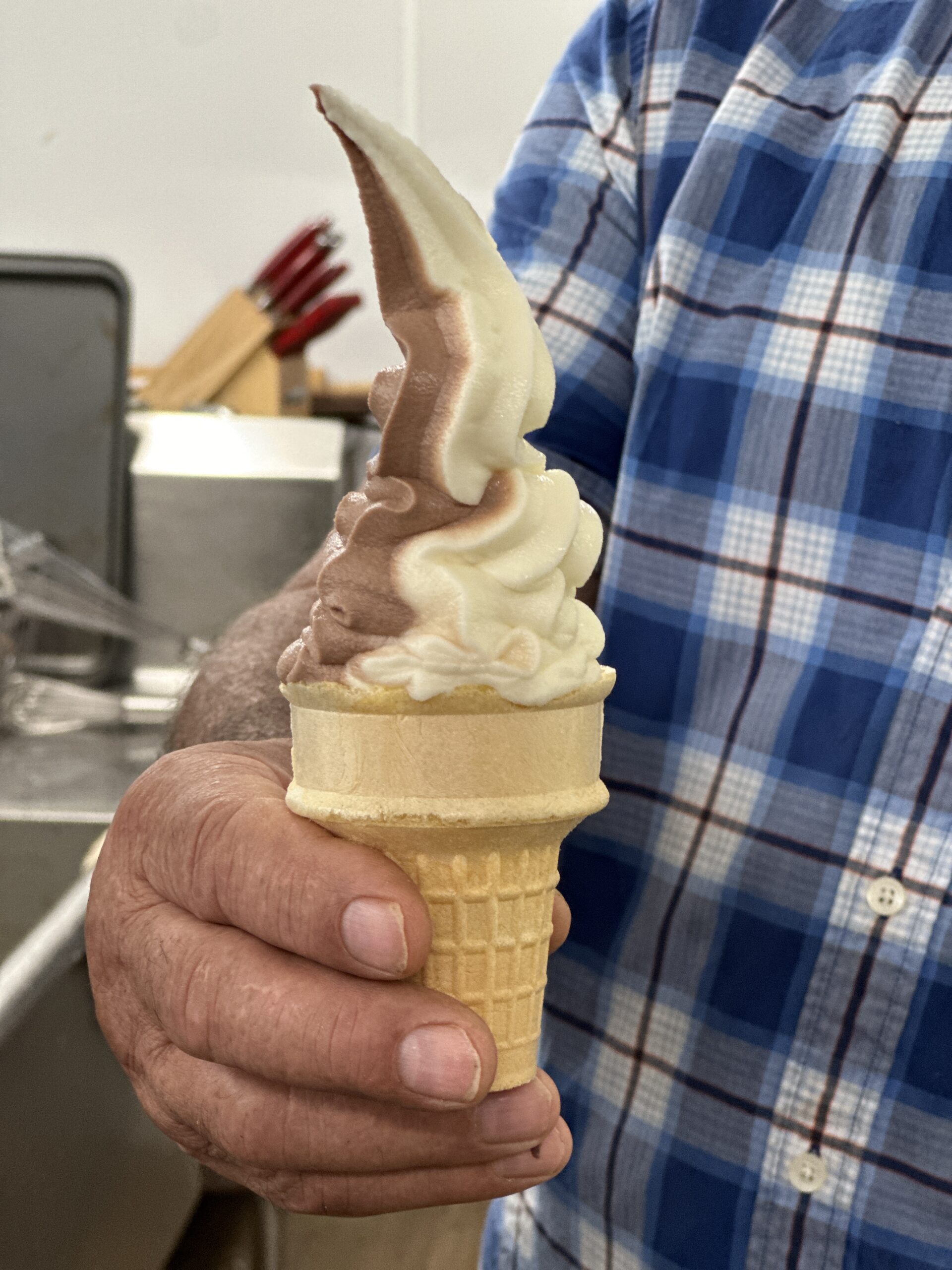 hand holding ice cream cone